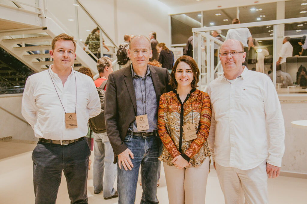 A group of four posing for a photo indoors