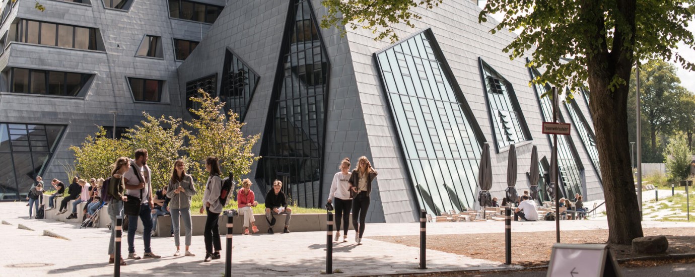 The Leuphana Campus building with students outdoors