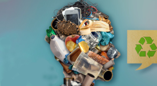 head made out of trash (plastic cups, banana peel, apple, toilet paper rolls, electronic waste) and a recycling sign next to it on a blue background