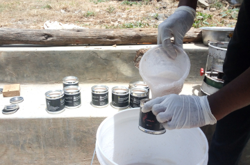 pouring a liquid in a can