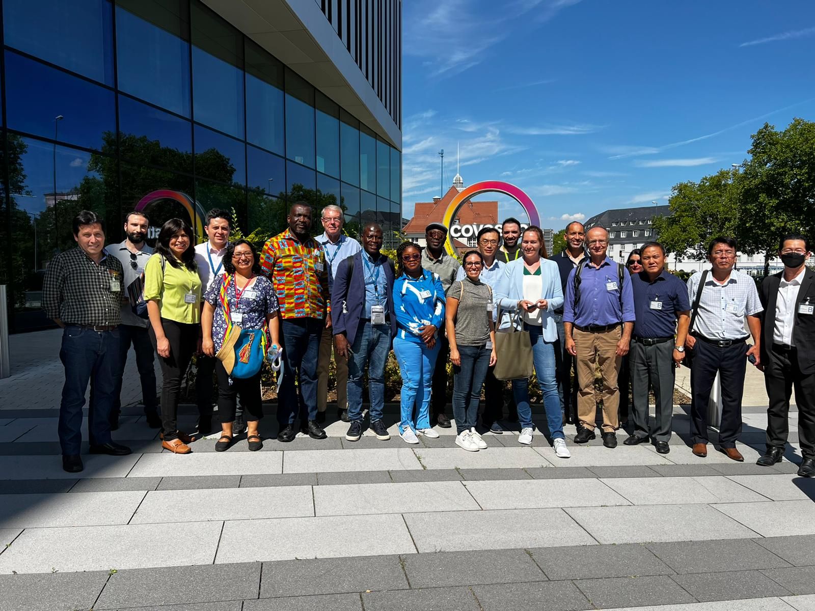 a group of people standing on a plaza outdoors