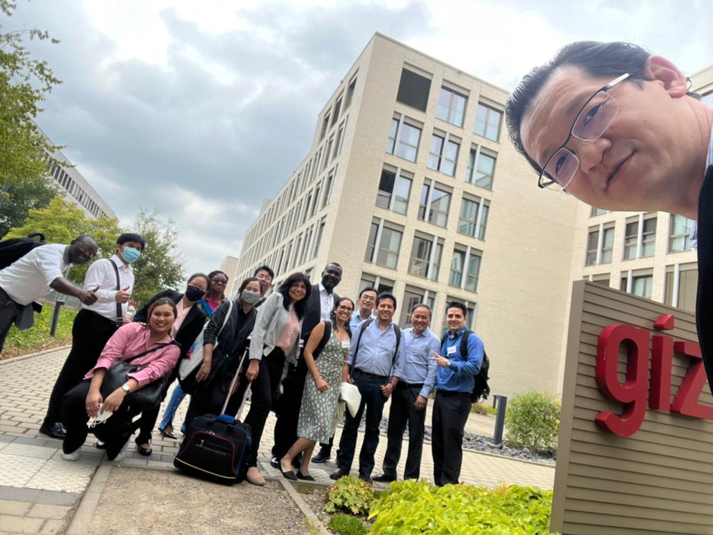 a group of people in front of a building outdoors