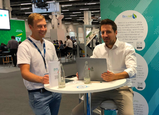 two men at a booth