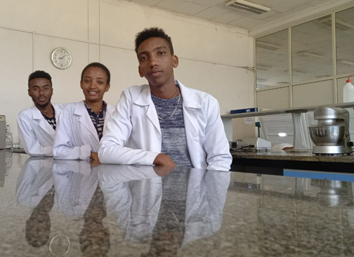 3 young founders from Ethiopia in the laboratory posing for picture