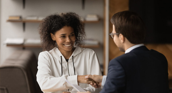 Woman shakes Hand with Consultant