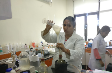 woman in a laboratory handling equipment