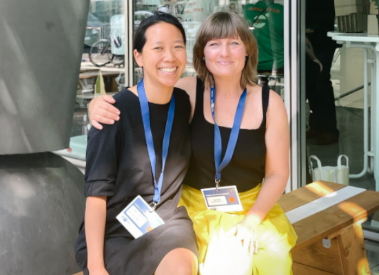 two women smiling into the camera