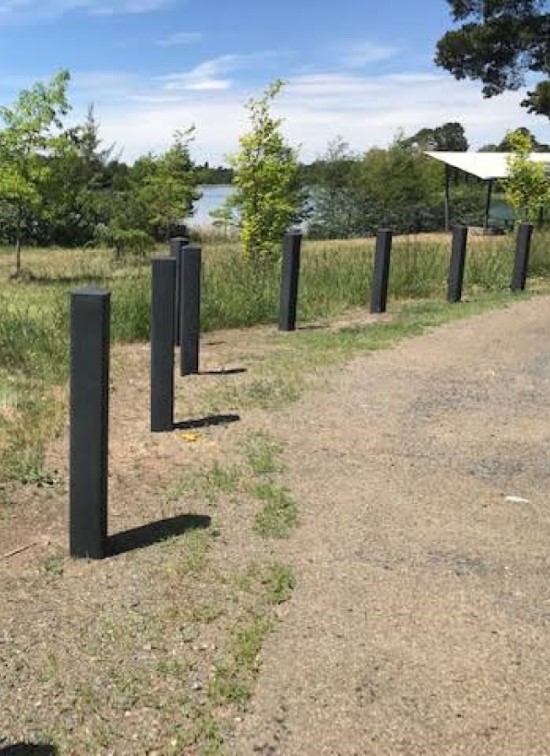 a fence at the side of the road