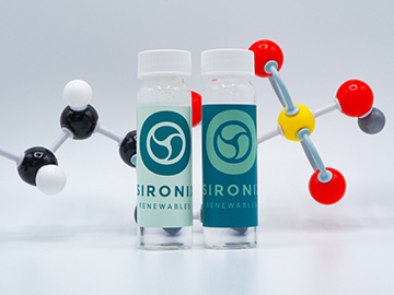 two flasks in front of an animated molecule