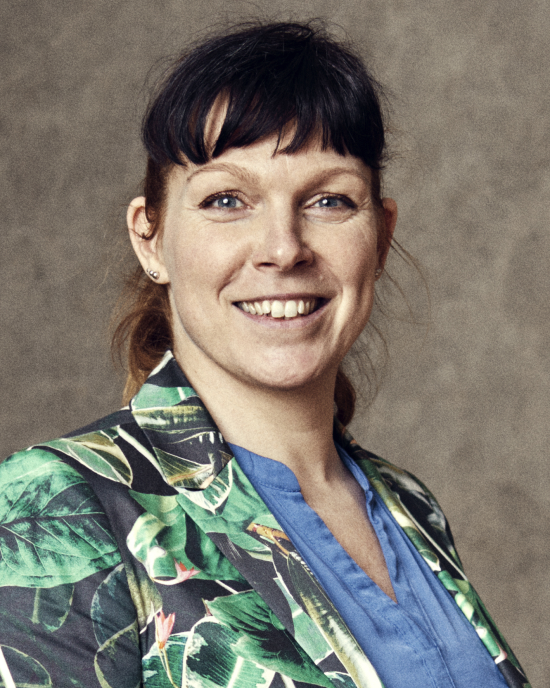 a woman smiling towards the camera