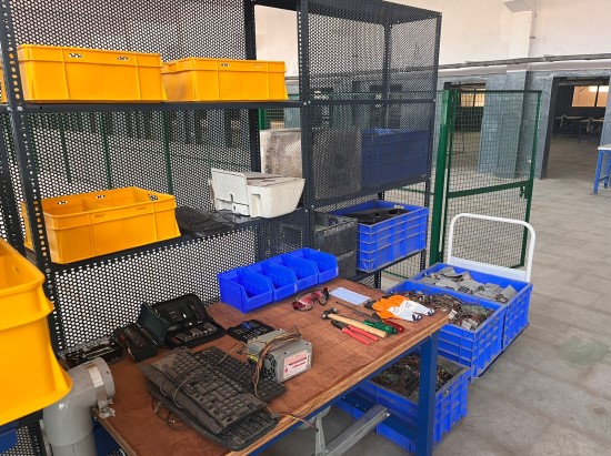 a work bench with multiple utensils for dismantling and sorting