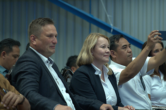 two persons sitting at a presentation