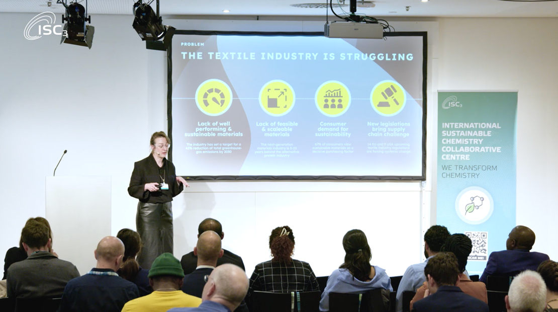 Woman presenting in front of audience