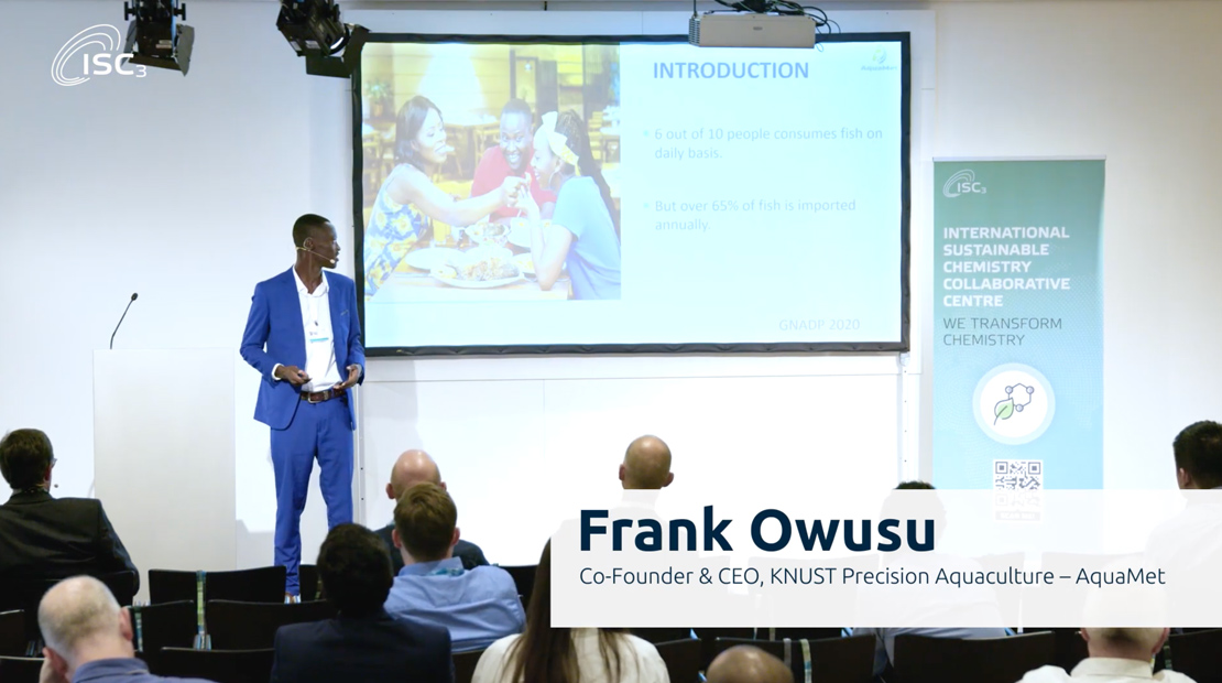 Man presenting on front of audience