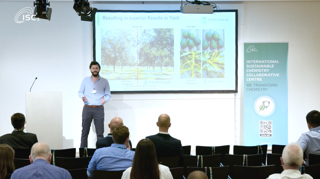 Man presenting on front of audience