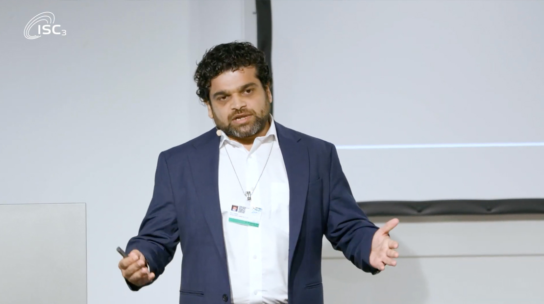 Man presenting on front of audience