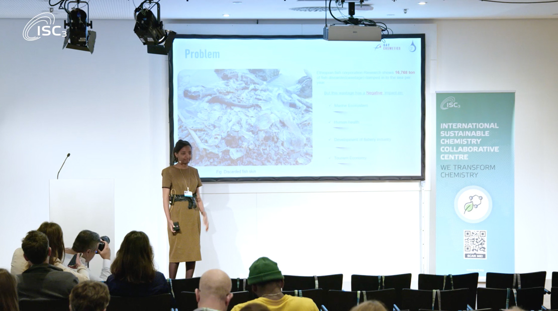 Woman presenting in front of audience