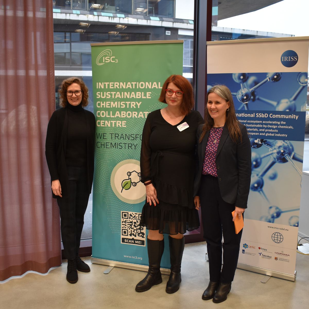 three women smiling at the camera