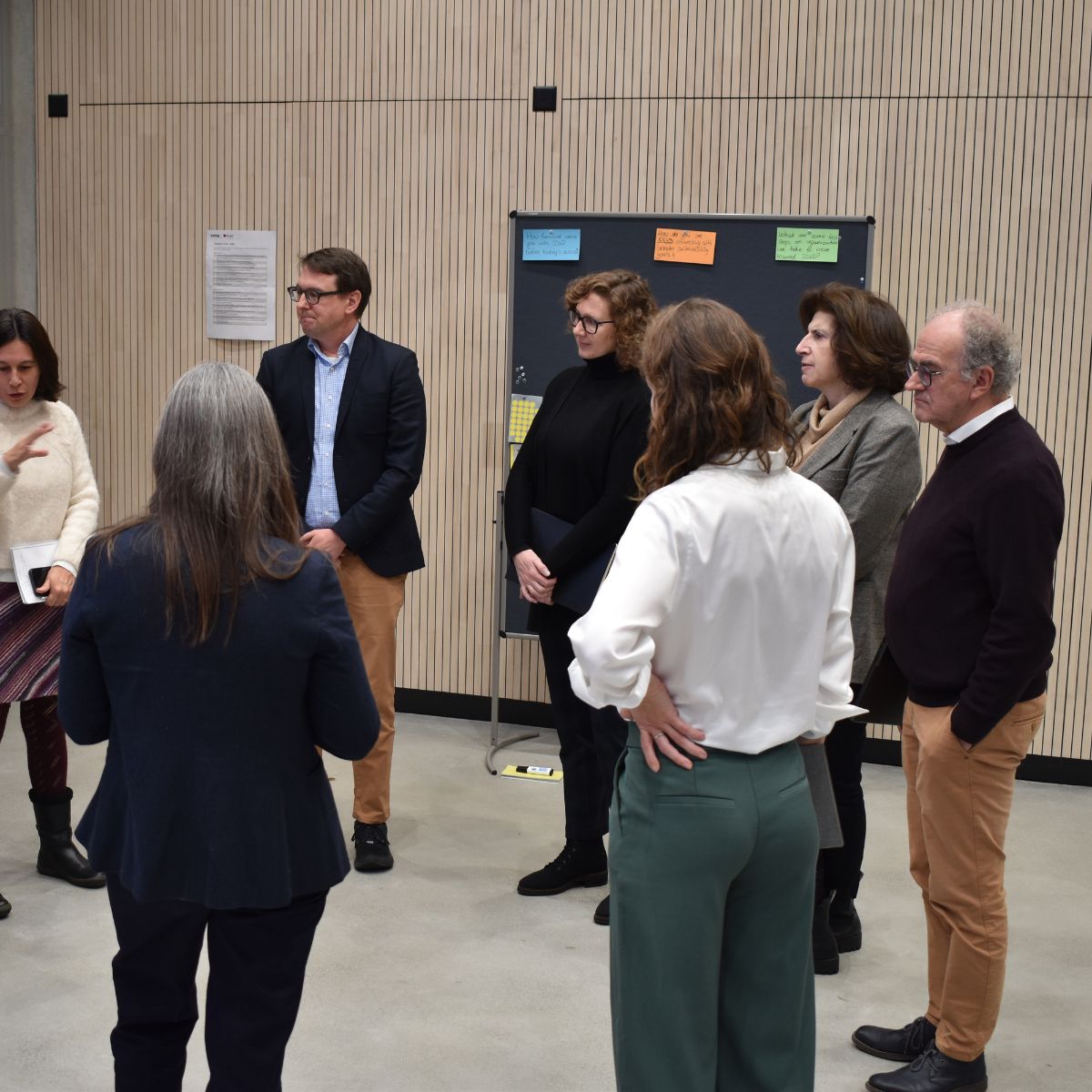 Group of people standing in a circle